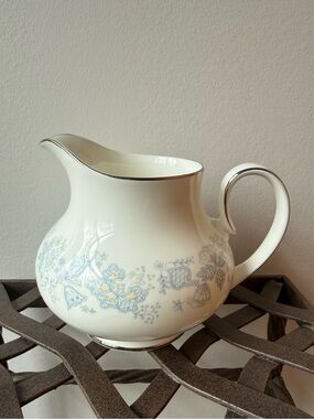 Royal Doulton White Pitcher with Pale Blue and Soft Yellow Floral Motif